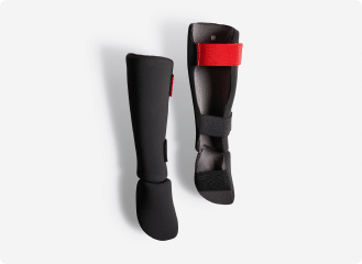 adult-kickboxing-shin-and-foot-guard-100-ergo-outshock-968504