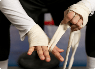 boxer-wrapping-his-hands-before-training-ring_23-2148759648